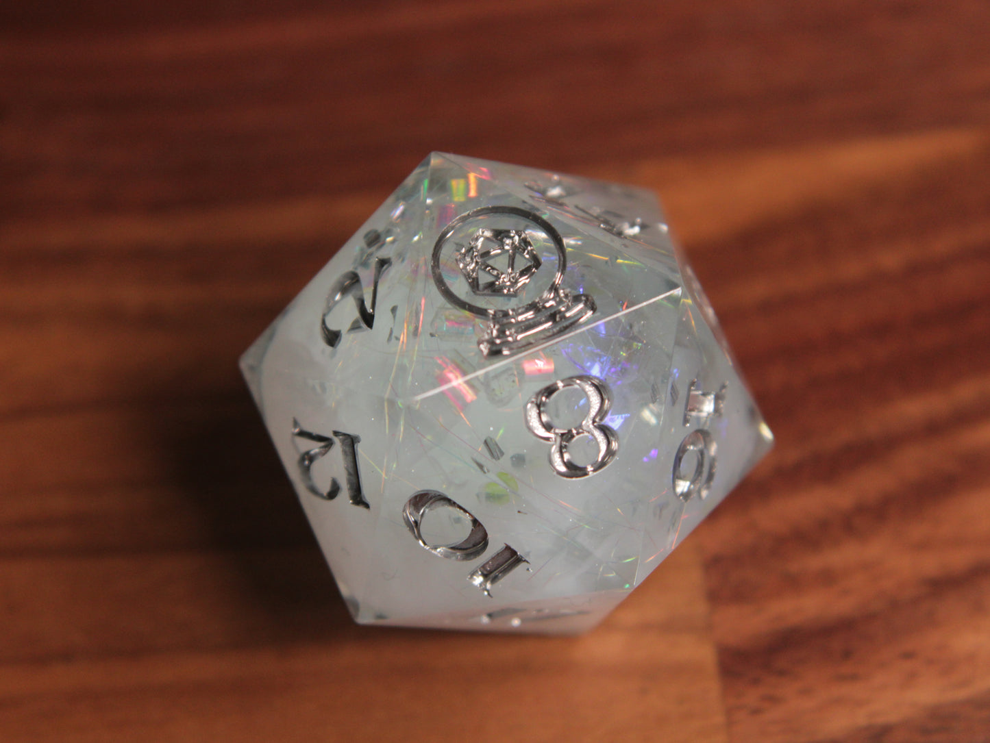 Large icy blue d20 with silver paint.